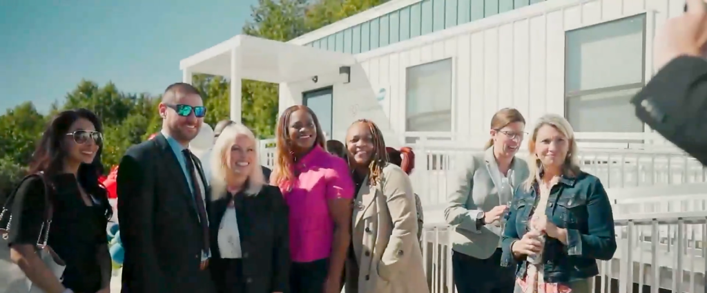 Guests celebrate outside the Dot Foods Family Health Center in Bear